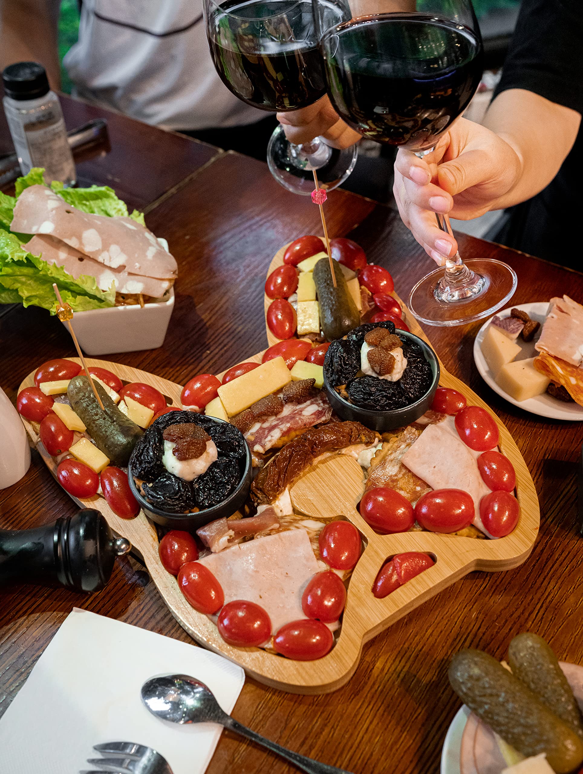 HOUSE PARTY 2K20 board beside everyday items to show 11-12 inch size for portion planning