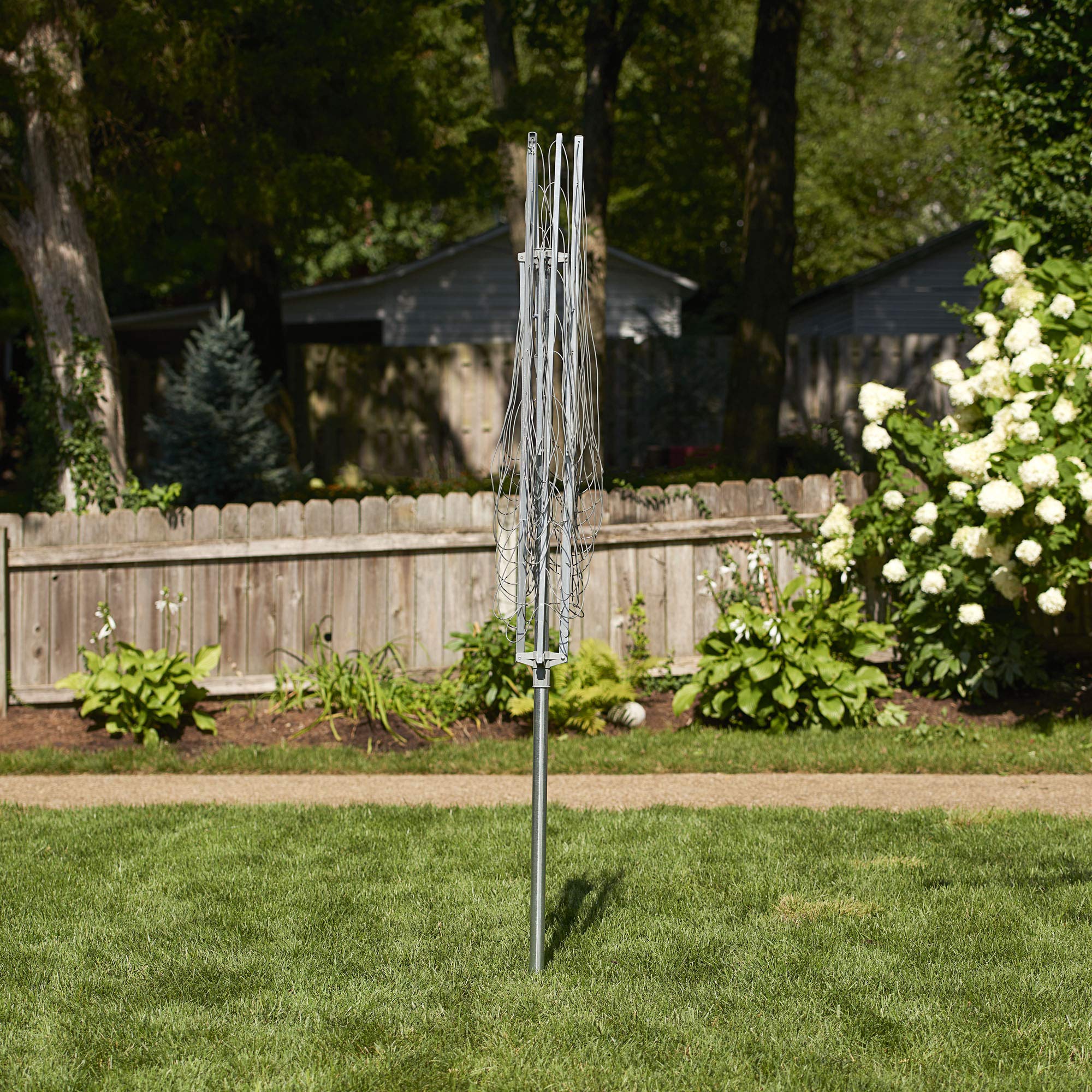 Household Essentials umbrella dryer set in a backyard showing tidy, energy-saving drying