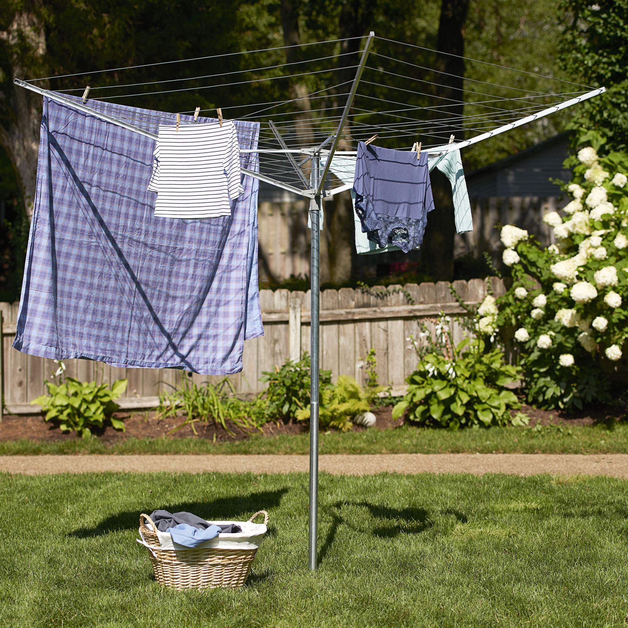 Household Essentials dryer next to person showing scale and practical backyard fit