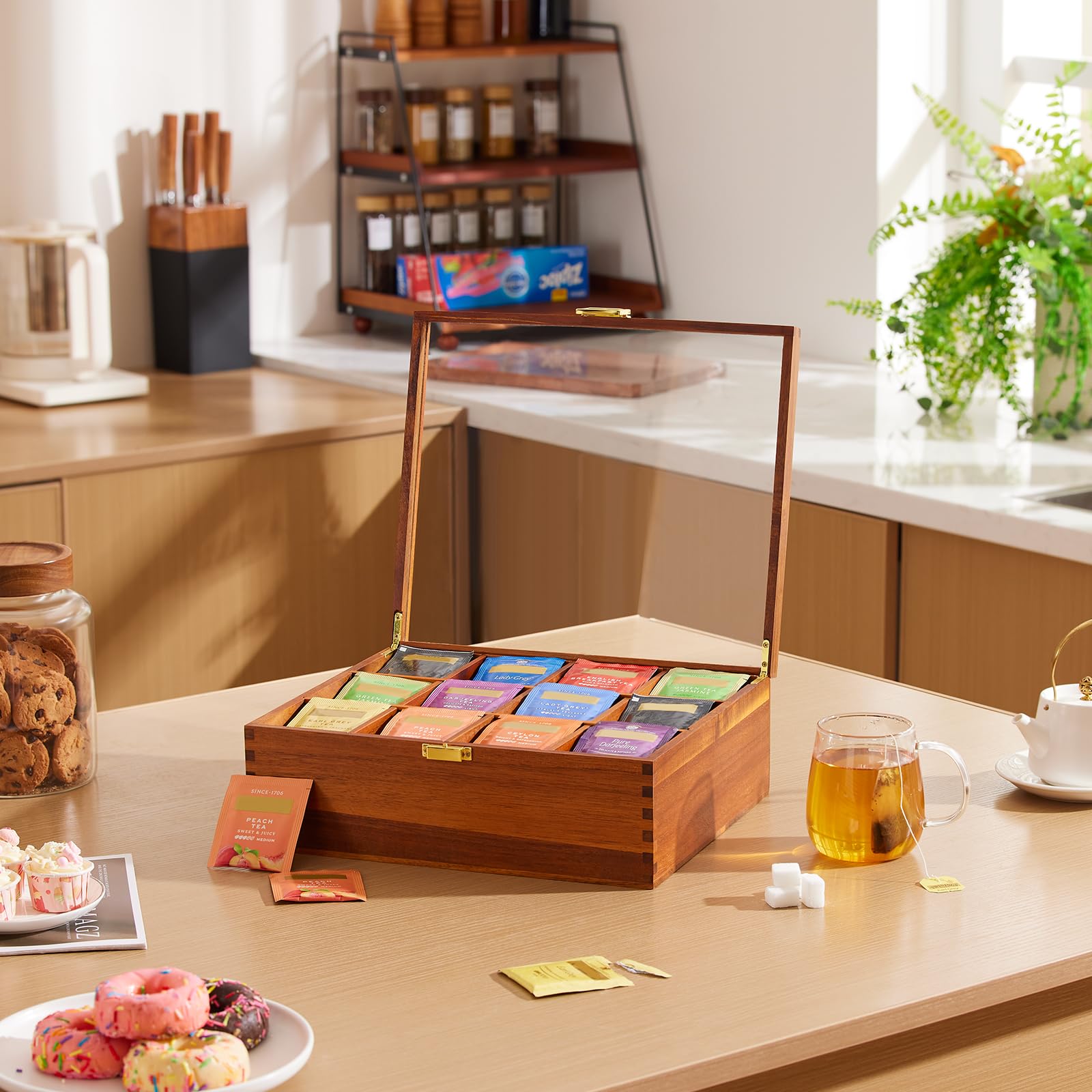 HouseJoy beside a coffee mug for scale, illustrating compact footprint and countertop suitability benefit