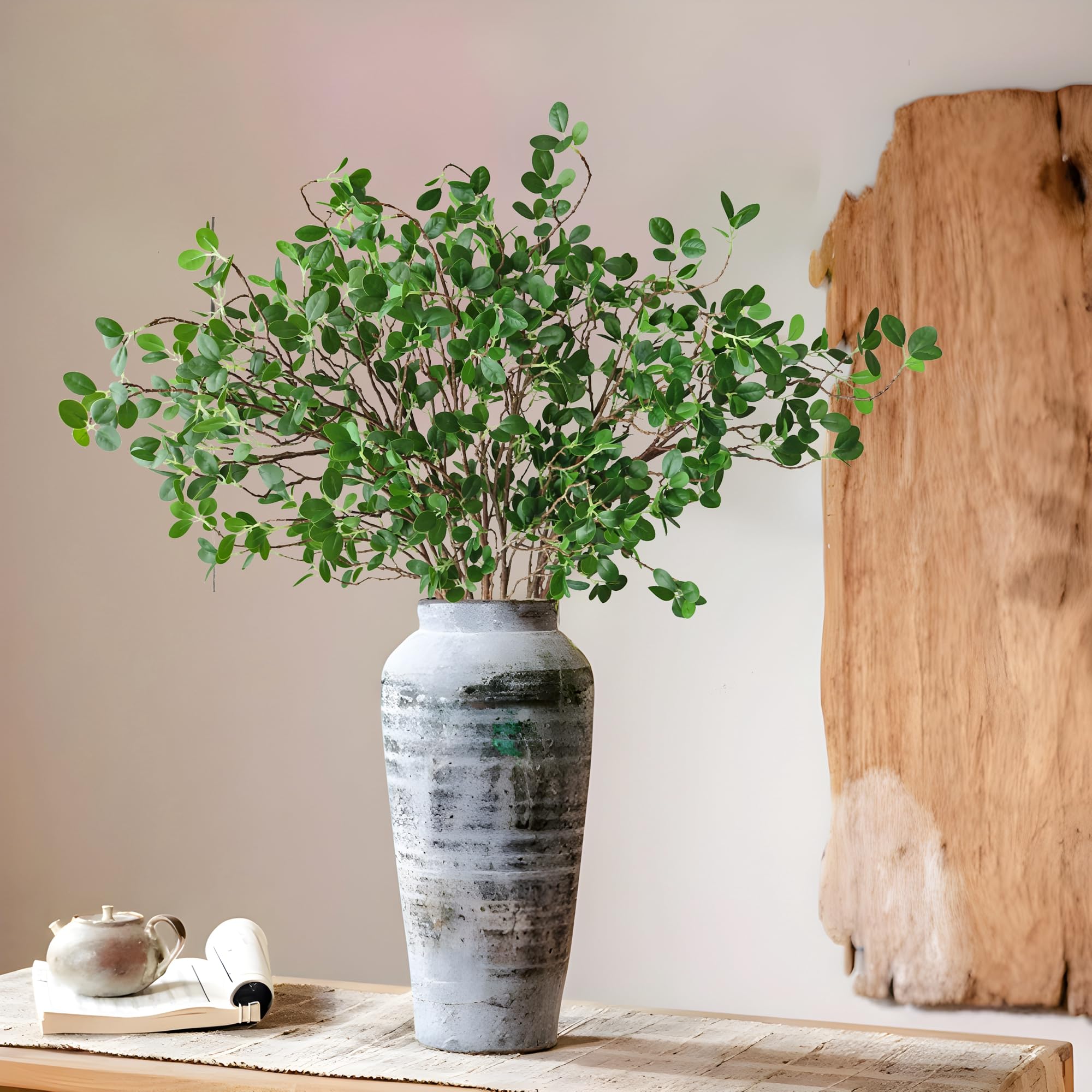 Htmeing tall stems arranged in a vase adding instant room height