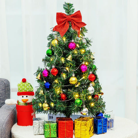 HUAERYOUYUE tabletop tree styled on a side table to add instant holiday ambiance