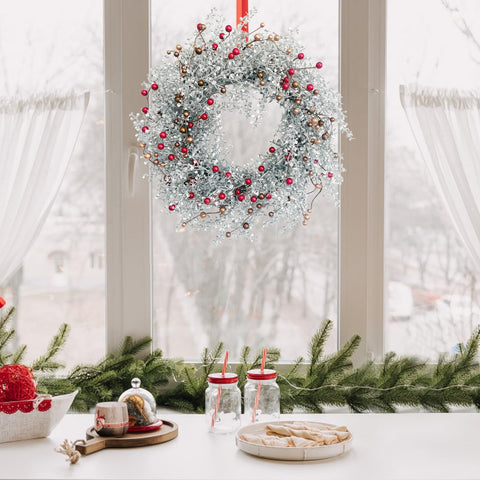 Huashen wreath next to door frame illustrating 24-inch scale and fit