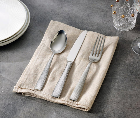 Hudson Essentials hand holding fork to show weight and scale