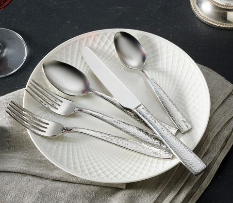 Hudson Essentials flatware beside dinner plate showing size scale and proportion benefit