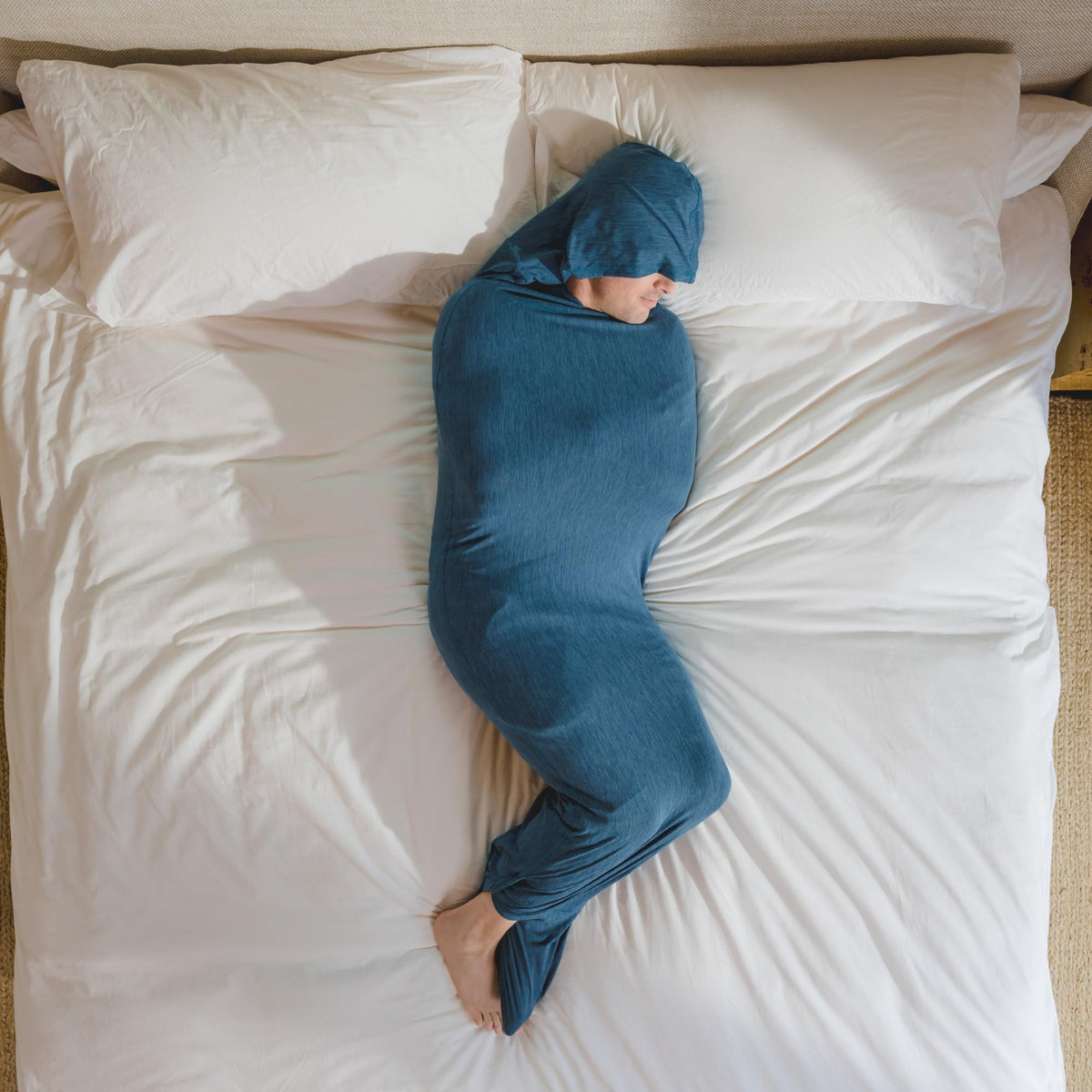 Hug Sleep front view of turquoise sleep pod showing full wearable blanket comfort and coverage