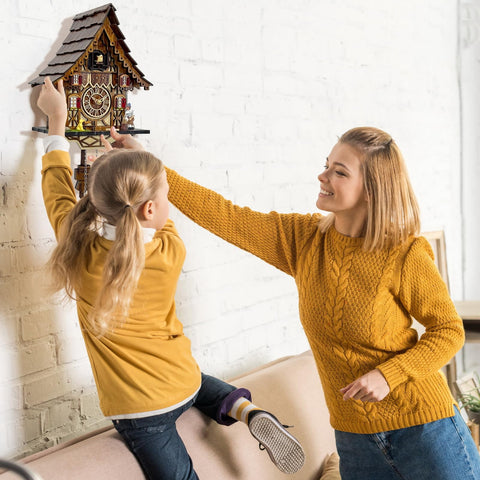 HUGE HAPPINESS clock held in hand to show size and easy wall placement