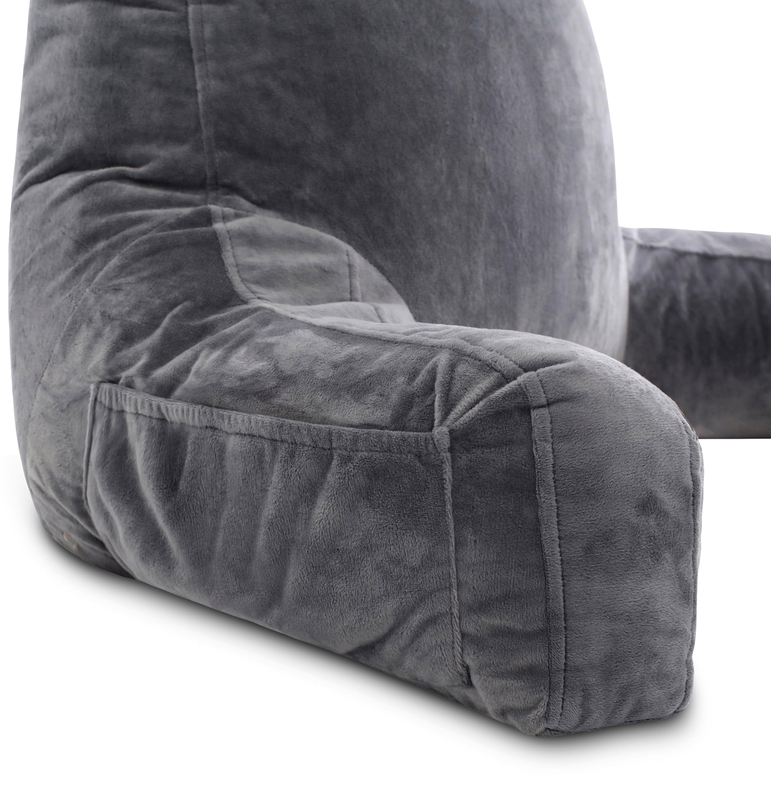 Husband Pillow in dark grey on bedroom chair demonstrating stylish comfort