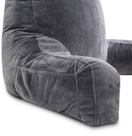 Husband Pillow in dark grey on bedroom chair demonstrating stylish comfort