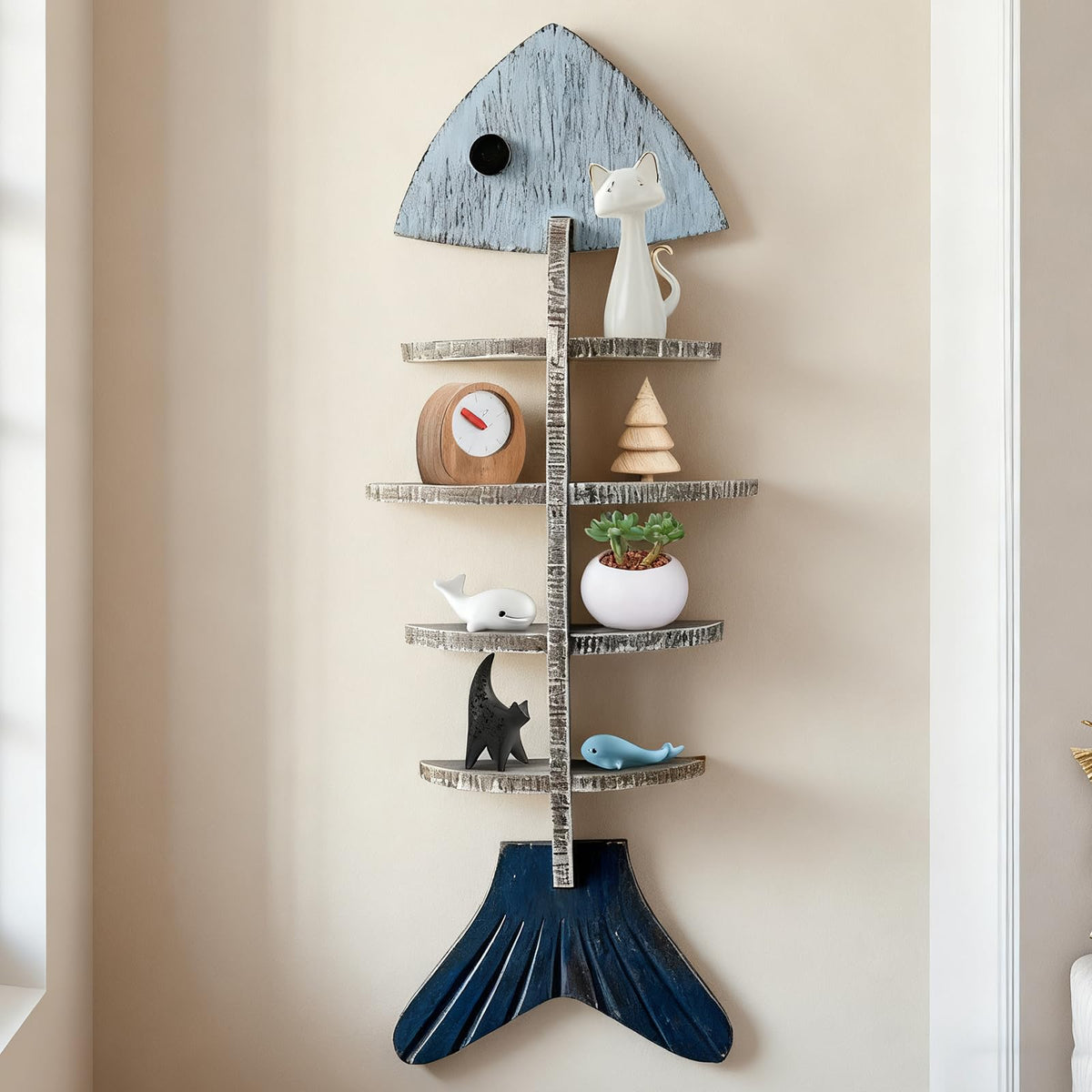 huulmood front view of fish-shaped wooden shelf shows nautical decor and organized storage