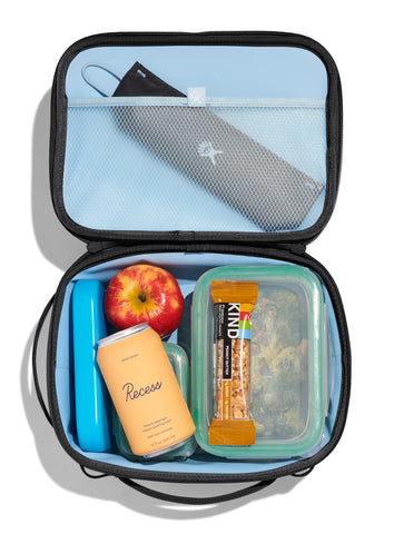 Hydro Flask lunch box being carried at the beach, portable and easy to transport