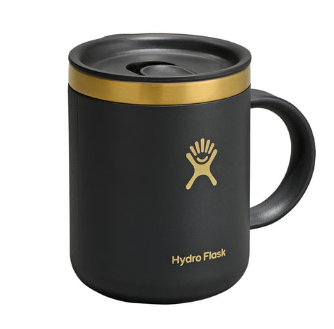 Hydro Flask mug sitting in a car cup holder illustrating travel-friendly fit and stability