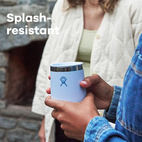 Hydro Flask next to standard wine glass showing 10 oz scale and practical size