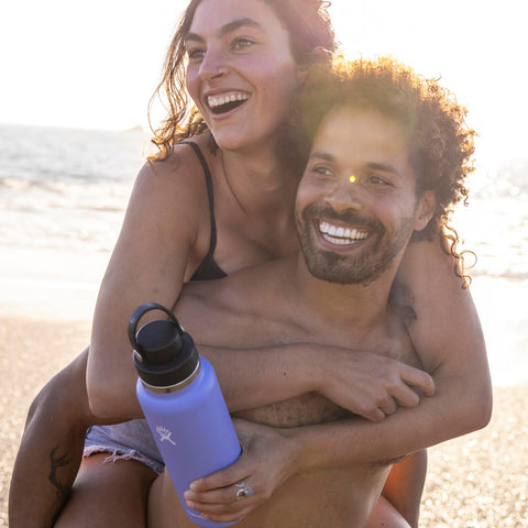 Hydro Flask on trail with hiker illustrating durable outdoor performance