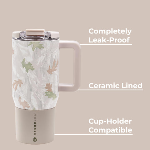 HydroJug in car cup holder demonstrating slim base and travel convenience