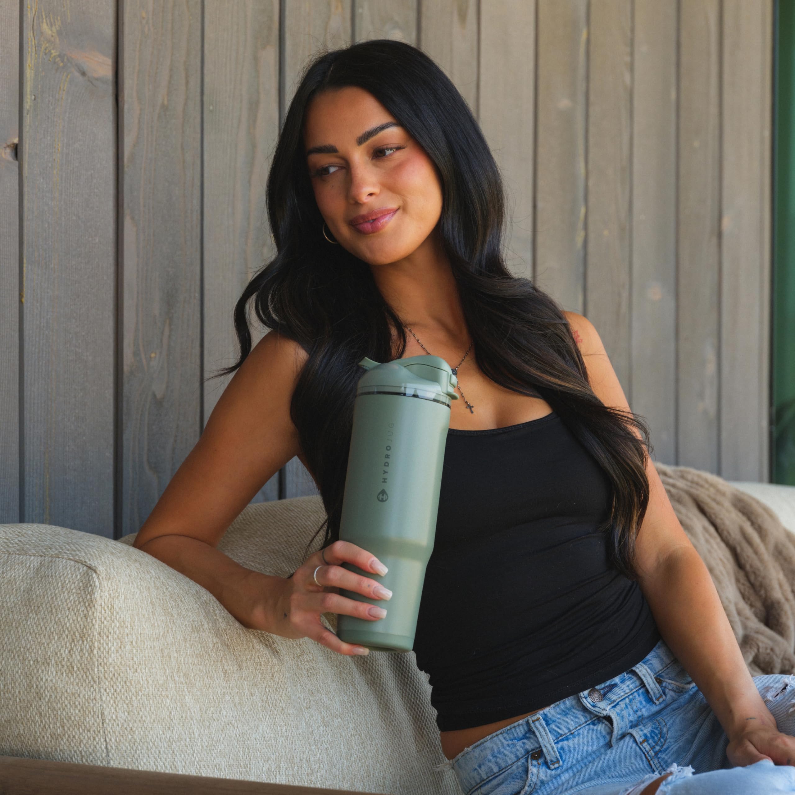 HydroJug Ease2o next to common items to show 32oz size and portability benefit