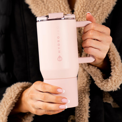 HydroJug seated in car cupholder showing commute-friendly fit