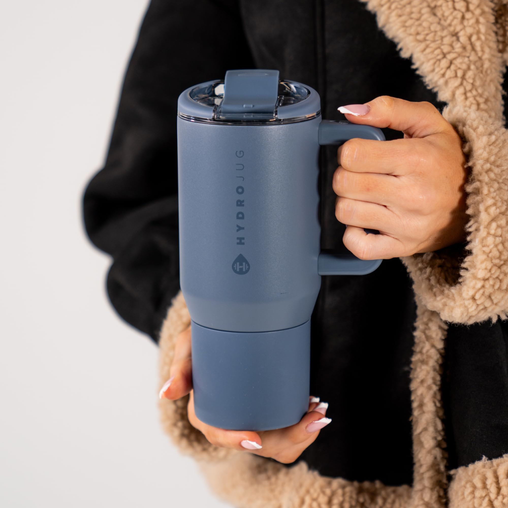 HydroJug seated in car cup holder for secure commuting convenience