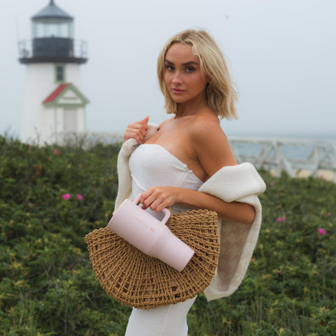 HydroJug Traveler in outdoor setting showing durable build and temperature retention benefit
