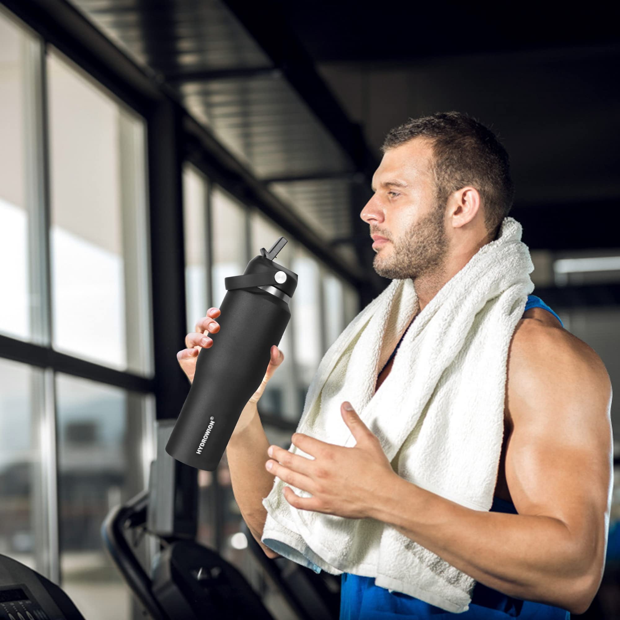 HYDROWION bottle on beach towel, durable and portable for outdoor adventures