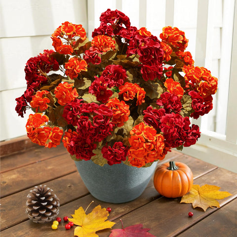 HyeFlora planter on front porch displaying lifelike geraniums and seasonal charm