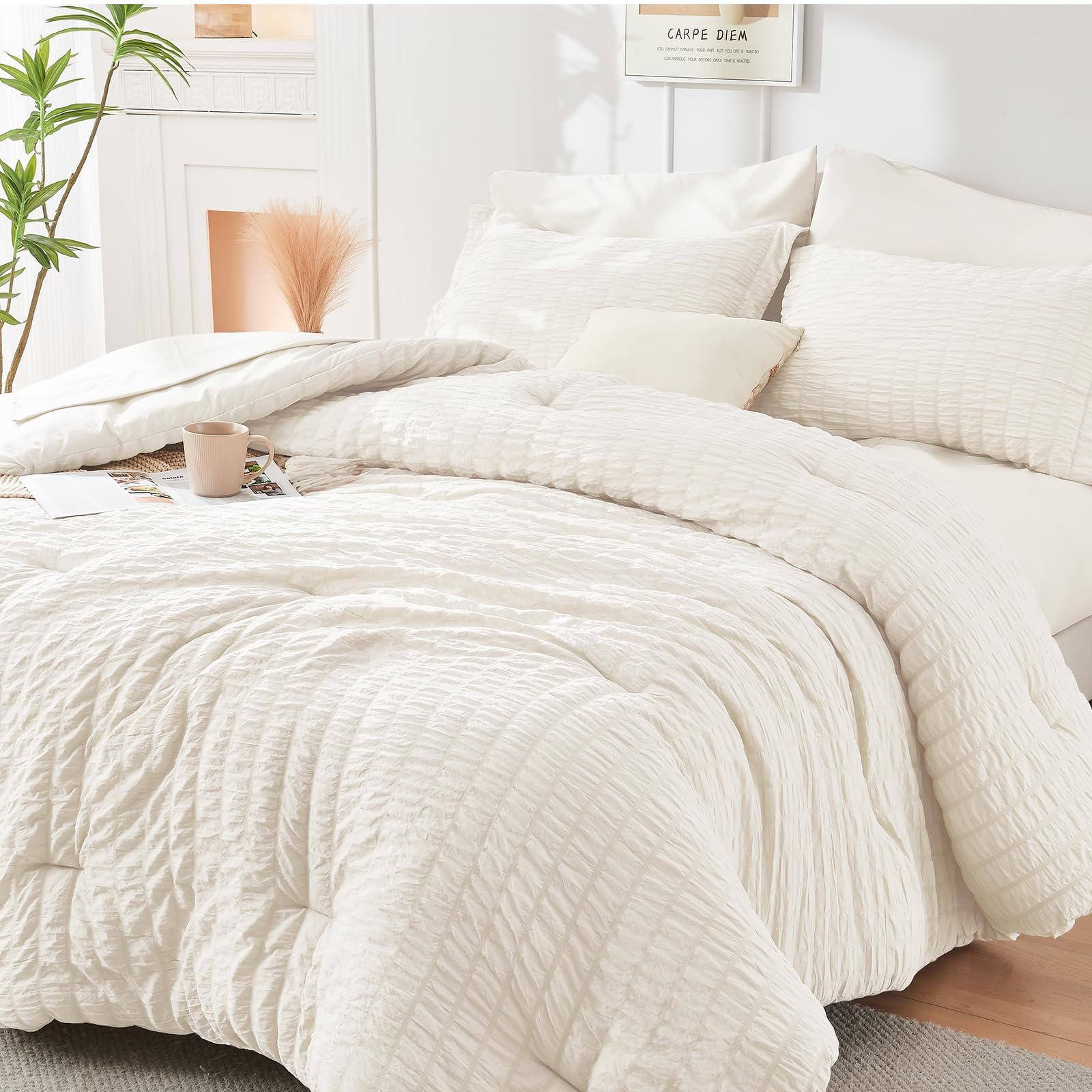HYMOKEGE ivory comforter front view showing neat packaging and instant bedroom upgrade