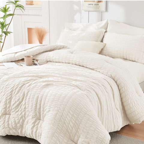 HYMOKEGE ivory comforter front view showing neat packaging and instant bedroom upgrade
