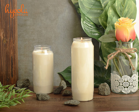 Hyoola candle beside a hand for scale to show its 7-inch tall size