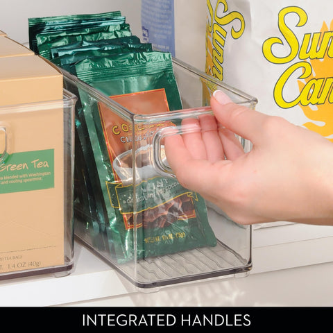 iDesign held in hand to show scale and suitability for shelves