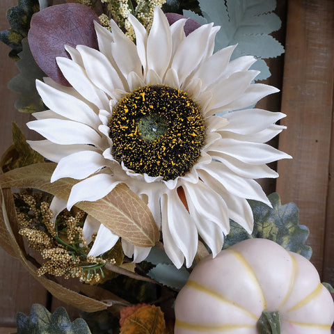 idyllic wreath hung on front door illustrating curbside scale and charm