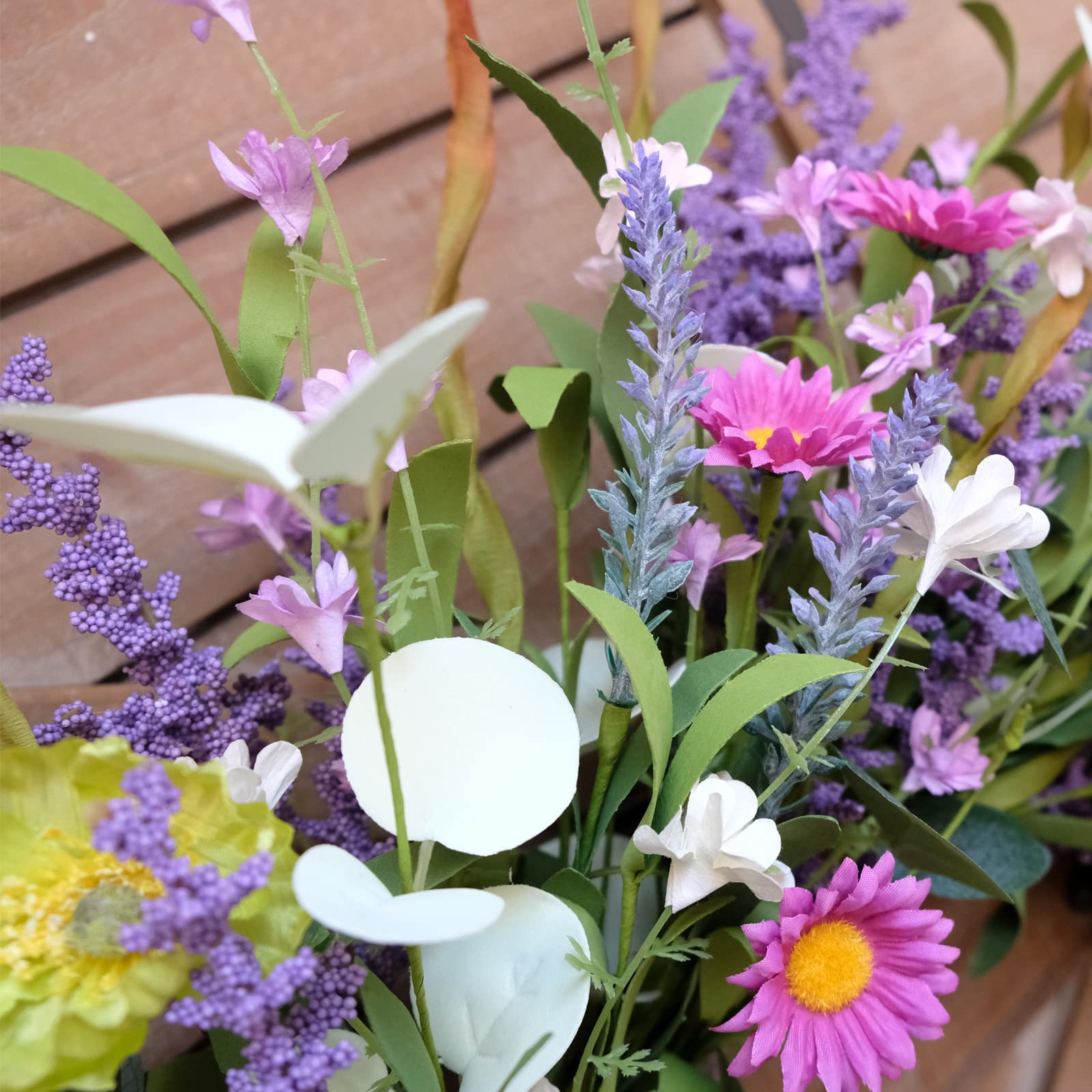 idyllic wreath on a covered porch demonstrating stylish sheltered display