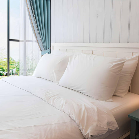 iFaon styled on guest bed highlighting minimalist decor and practicality