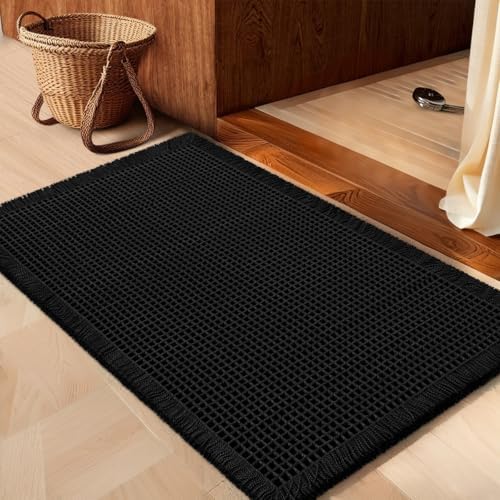 IM HOME front view of black waffle bath mat showing boho style and absorbency