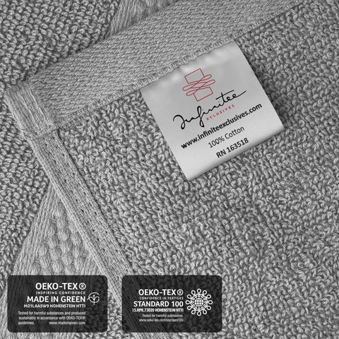 Infinitee Xclusives towel held in hand showing true-to-size practical scale