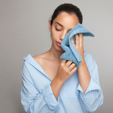 Infinitee Xclusives washcloth draped in bathroom setting showing spa-like comfort