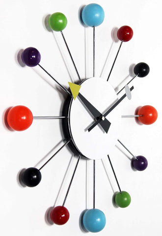 Infinity Instruments clock displayed over sofa illustrating scale and instant room styling
