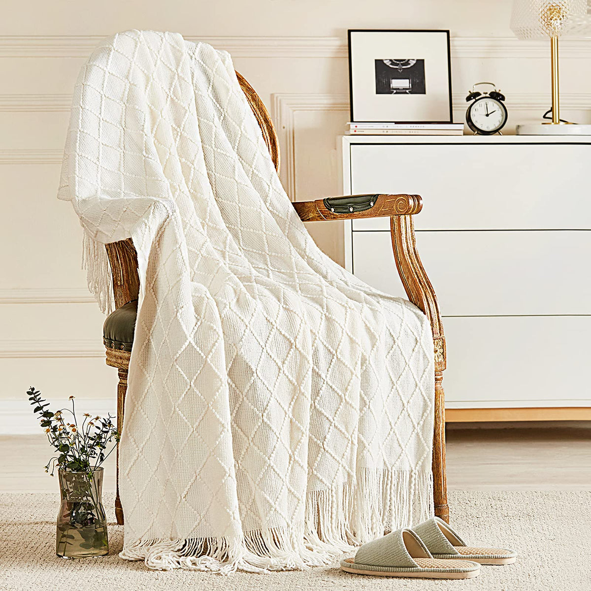inhand front view of off white throw showing full design and cozy appeal