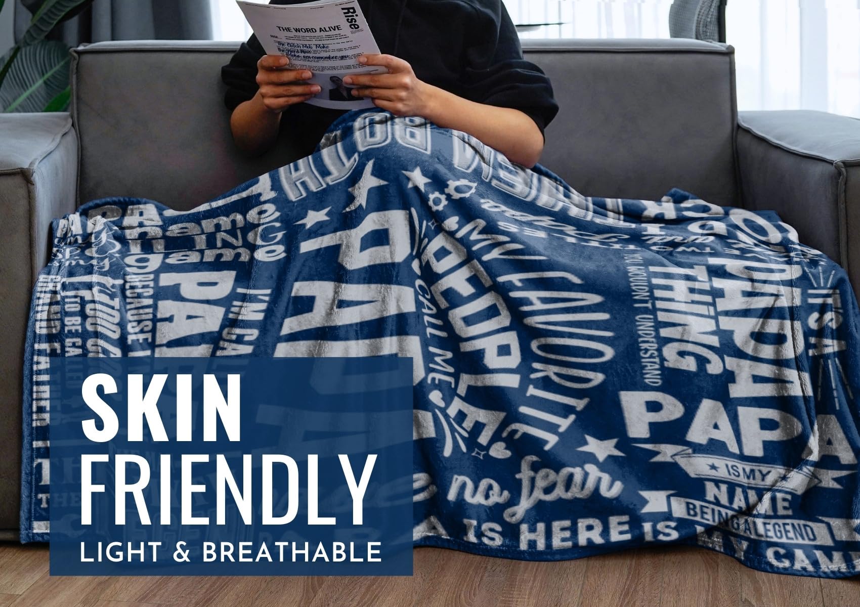 InnoBeta blanket draped on sofa with grandpa demonstrating comfort