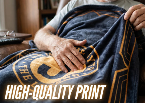 InnoBeta folded throw beside book showing compact size and easy portability