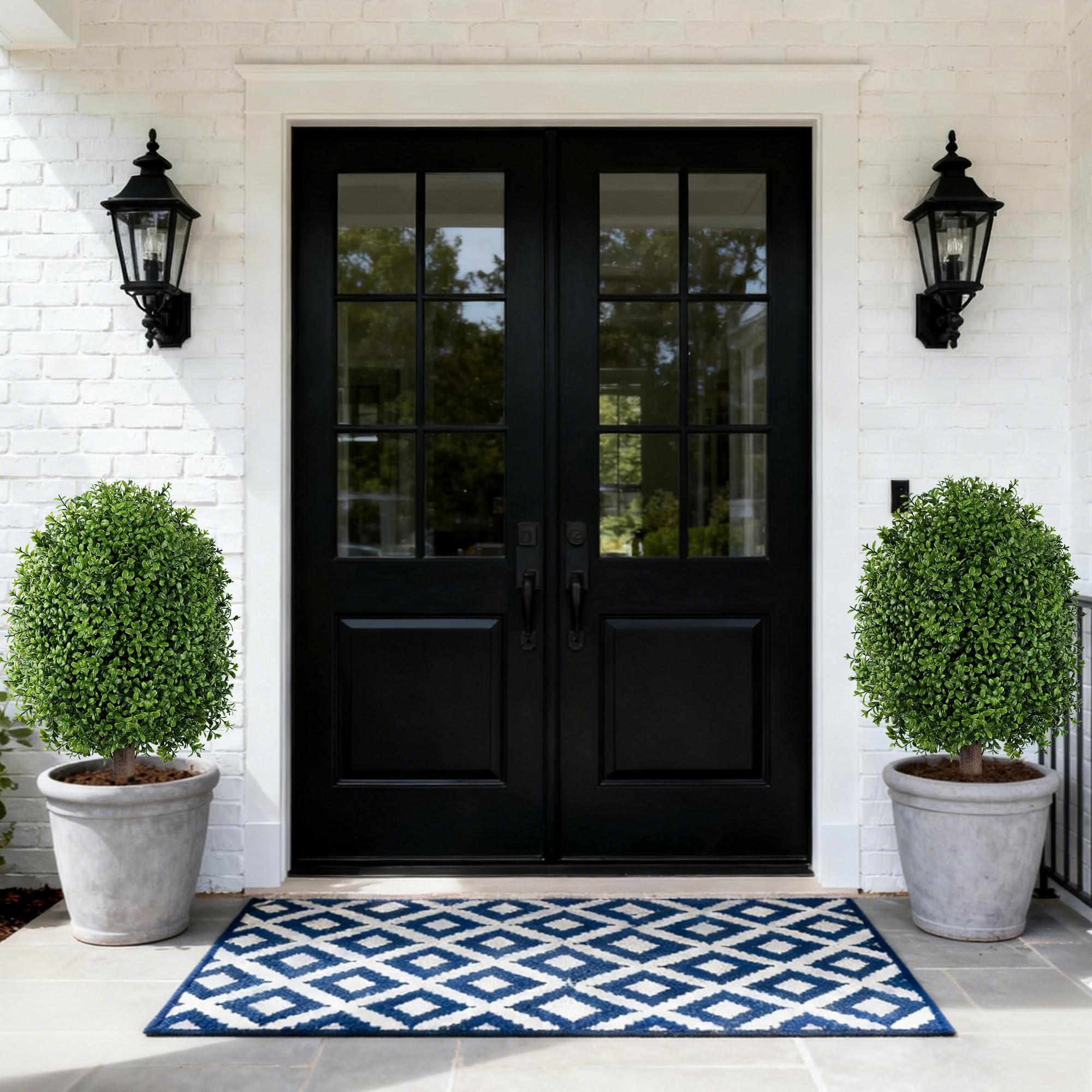 INSPRING dual topiaries on porch framing doorway for balanced entrance design