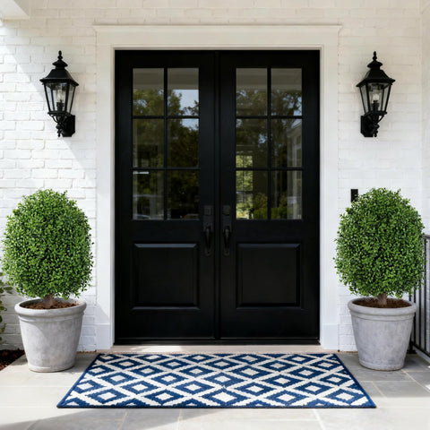 INSPRING dual topiaries on porch framing doorway for balanced entrance design