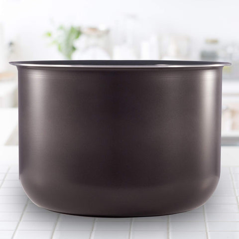 Instant Pot inner pot beside common items to show 6‑quart capacity advantage