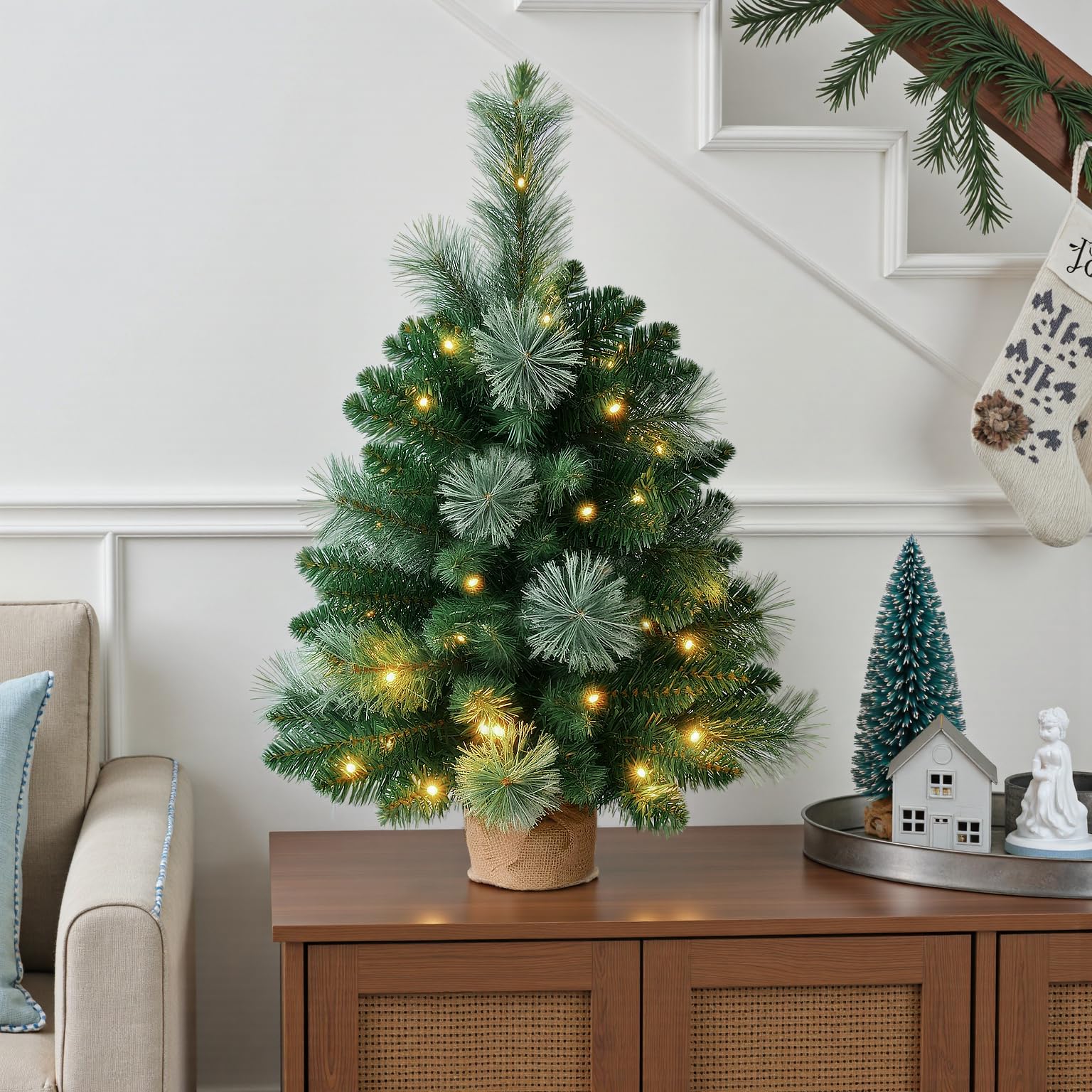 INSTREE CHRISTMAS remote and timer beside tree, offers easy control and scheduling