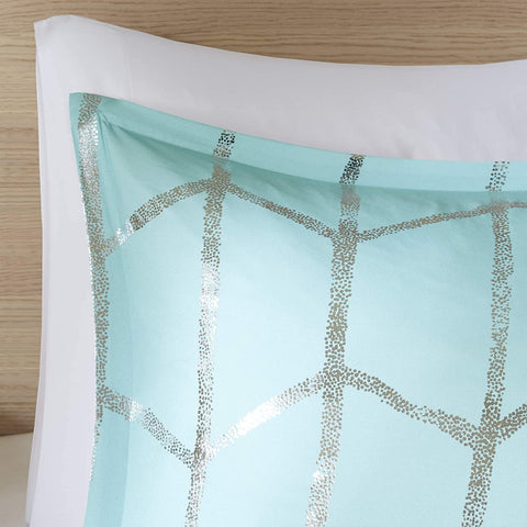 Intelligent Design hand touching brushed microfiber to show softness and cozy comfort