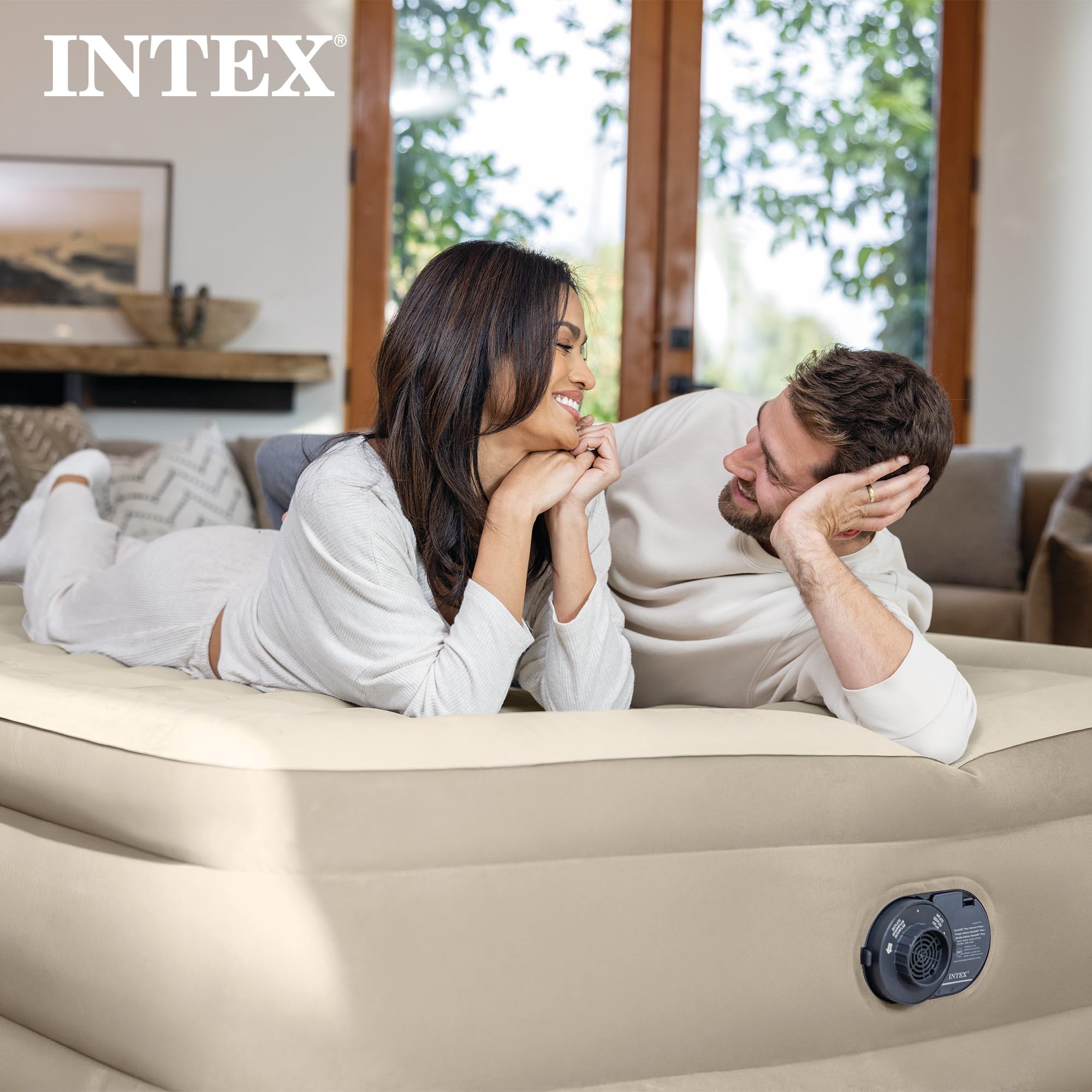 Intex Dura-Beam Deluxe being deflated and folded illustrating easy storage