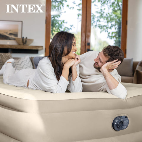 Intex Dura-Beam Deluxe being deflated and folded illustrating easy storage
