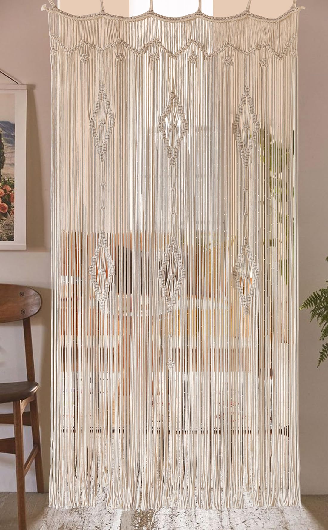 IOWER macrame curtain hung in a sunlit window, softens light and creates warm ambiance