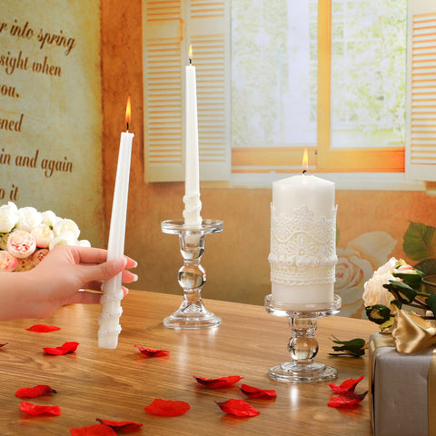 Irenare lit candles in ceremony setting creating romantic soft illumination