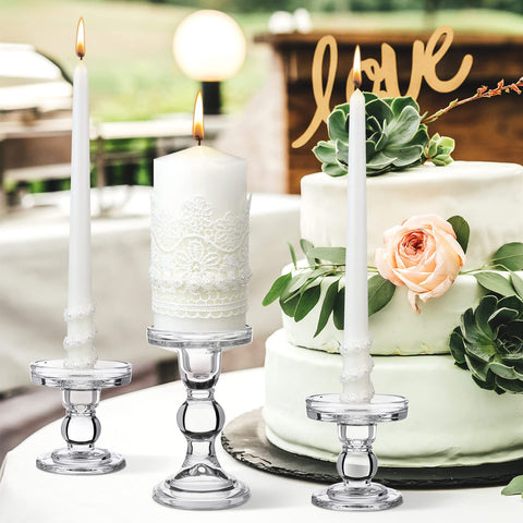 Irenare styled table centerpiece with candles adding warm ambiance at a wedding