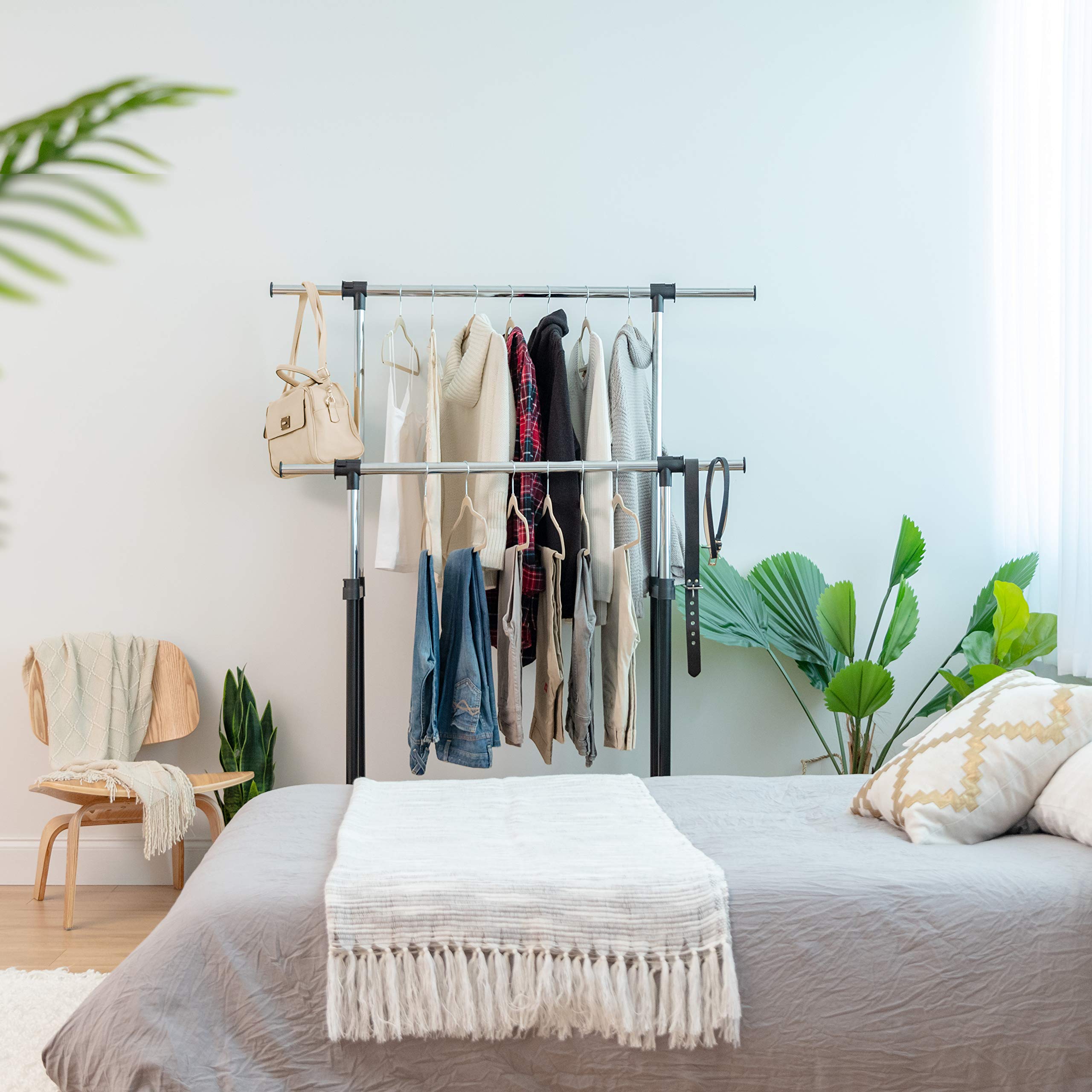 IRIS USA styled in an entryway showing tidy, accessible temporary closet storage